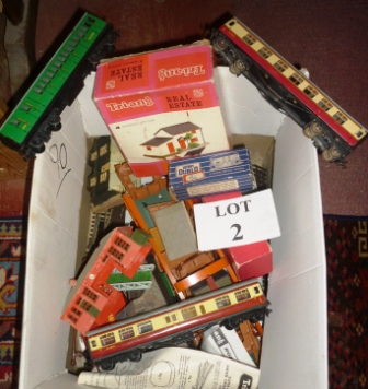 A collection of Hornby and Triang items to include track, buildings and carriages est: £50-£100 (