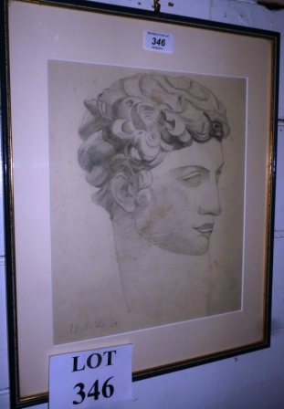 A framed pencil sketch of a young man in the Greek manor dated 17/1/34  (12 1/2" x 10" approx)