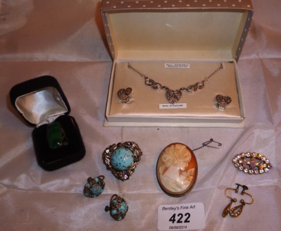 A collection of costume jewellery to include a cameo brooch, a malachite ring and a marcasite