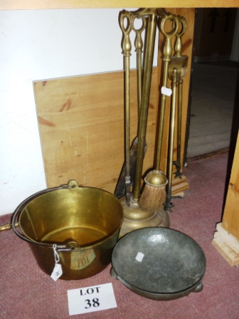 A 19th century brass preserve pan; a set of fire irons and stand; another fire iron and a hammered