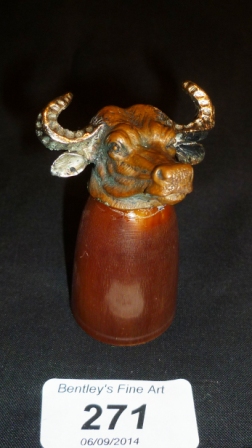 A horn candle snuffer with oxen head est: £50-£80