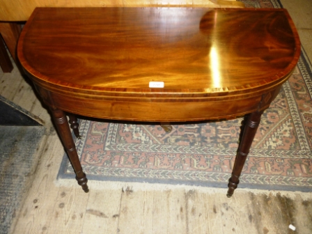 A 19c D shape turn over card table in mahogany est: £200-£300