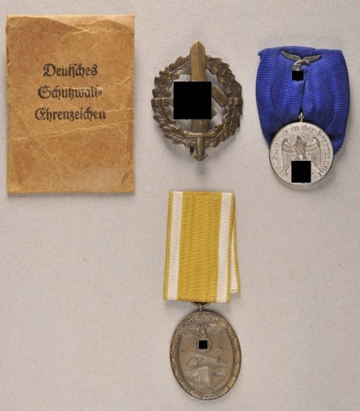 Germany (1933-1945)  Property of the airforce with 3 decorations.  1.) badge for the Wehrmacht,
