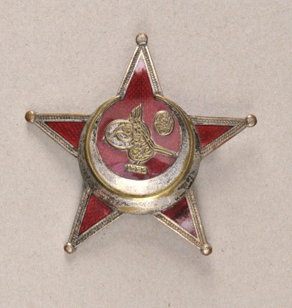 Turkey  Osmanian war medal.  Silvered, partly enameled, hallmarked BB&Co, on needle.  Condition: II