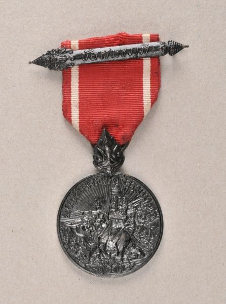 Thailand  Campaign medal of the Indochina war.  Blackened, on a made-up ribbon with buckle.