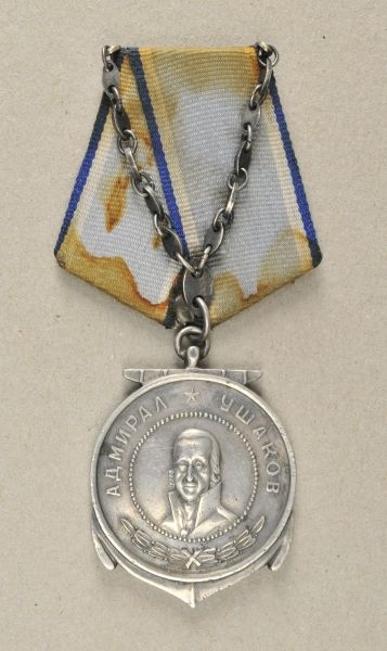 Russia  Uschakow-Medal.  Silver, the ankor separatly attached, number 8533, on dirty five-side