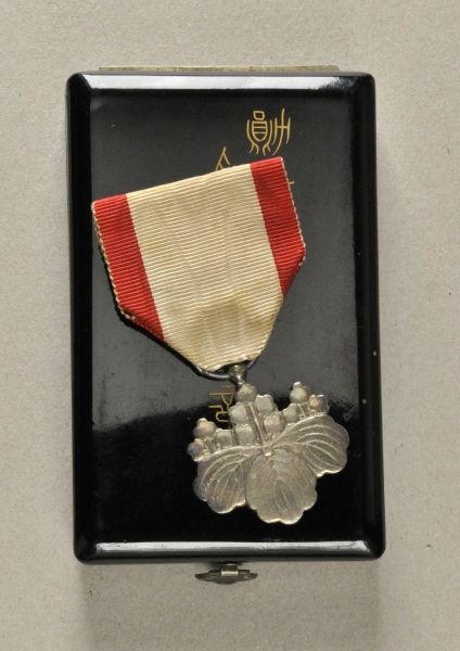 Japan  Order of the rising sun, 8. class, in box.  Silver, on ready to wear ribbon; in black