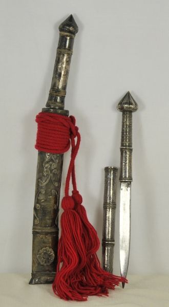 Ethnologica  Buthan / Tibet, pair Dah.  1.) Iron blade, pointed, grip and scabbard covered with