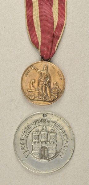 Hamburg  Estade of a Fire brigade member from Hamburg.  1.) Medal for the Aid at the city fire in