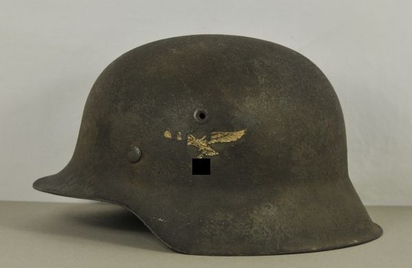 Air Force  Steel helmet, M35, Luftwaffe.  Camo paint, partially covering the eagle, in the neck