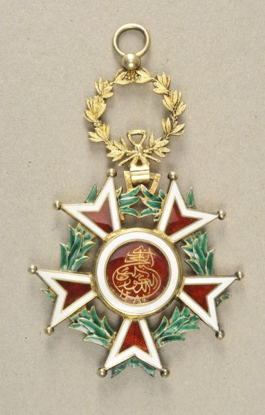 Zanzibar  Order of the bursting star, 9. model (1918-1964), badge for the 1st class.  Silver gilded,