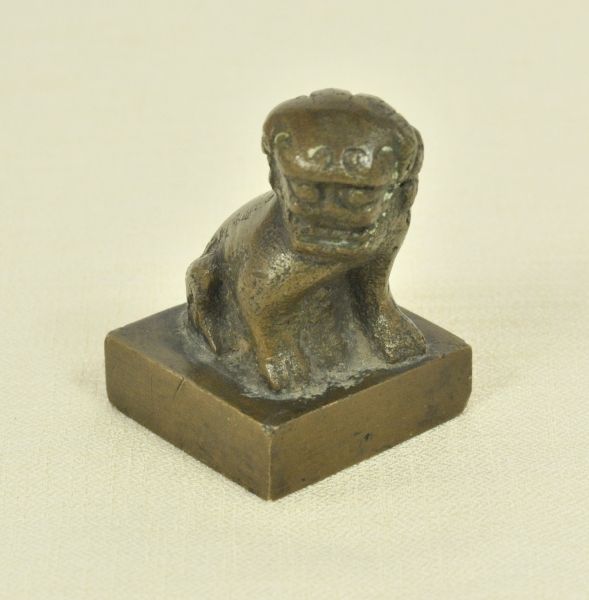 China  Guarding Lion.  Bronce lion, male sex (as the left paw sits on a ball, while female ones hold