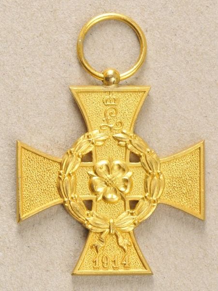 Lippe-Detmold  Merit Cross, on ribbon.  Bronce gilded.  Condition: II    Starting price: 40