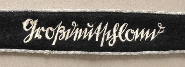 Army  Cufftitle "Großdeutschland".  Black fabric, maschine woven, silver eges. Late NCO-issue.