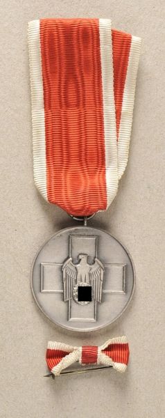 Germany (1933-1945)  Volkspflege medal.  Silvered, on ready to wear ribbon; with bow.  Condition: II