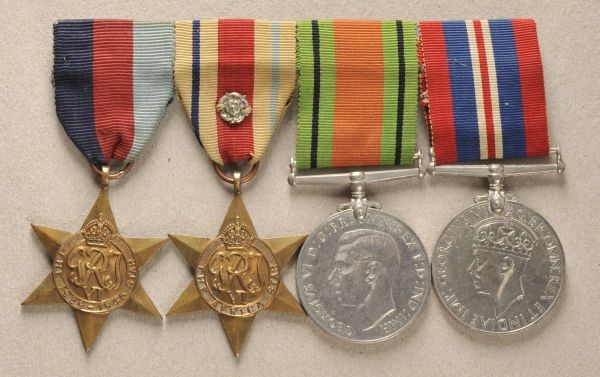 Great Britain  Large mounted medalbar with 4 decorations.  1.) 1939-1945 star; 2.) Africa Star, with