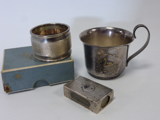 A 19th Century Dutch silver child's cup with embossed scene of a Swan and cygnet on a river, 6cms in