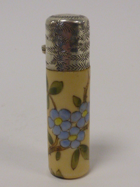 A ceramic scent bottle with white metal engraved hinged lid, glass stopper, hand painted with