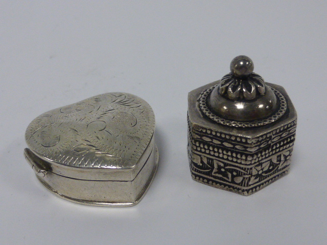 Two silver pill/trinket boxes, one heart shaped with hinged lid stamped 925, the other of