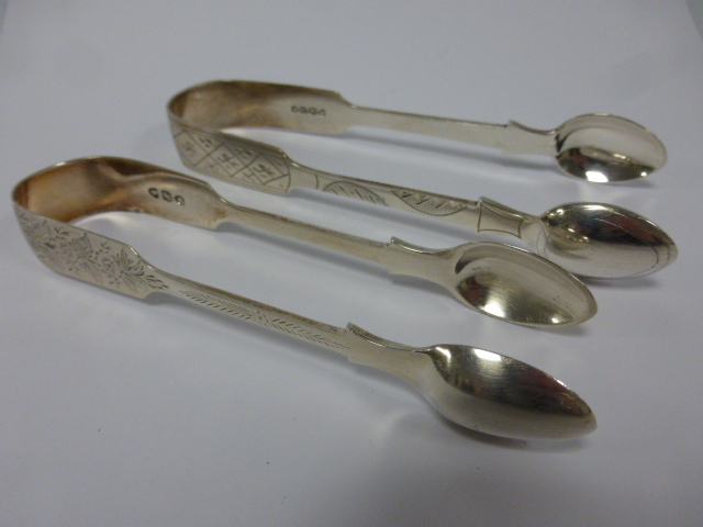 Two pairs of Victorian silver sugar tongs, hallmarked London 1875 and London 1895, 86g