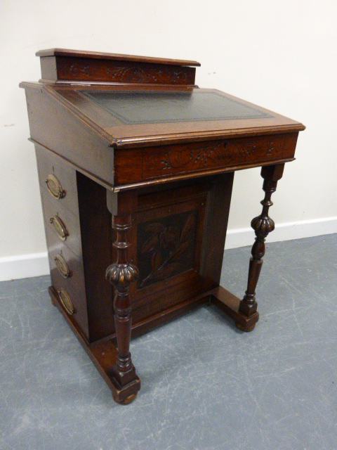 A 19th Century mahogany Davenport, the moulded pen box over tooled leather skiver, hinged slope