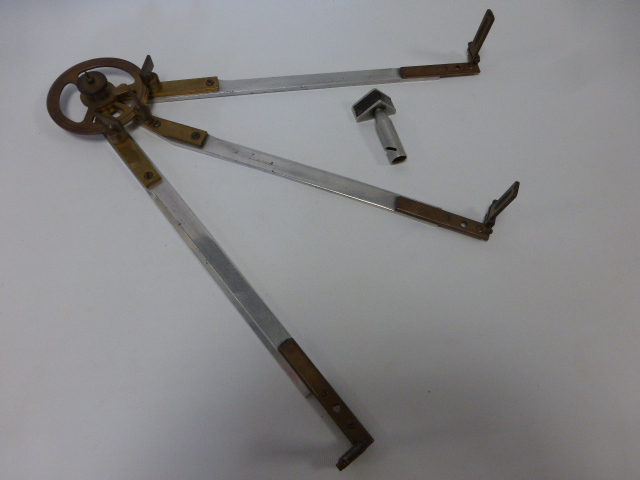 A brass and aluminum three-arm Station pointer, unsigned 38.7cms long together with a vertical prism