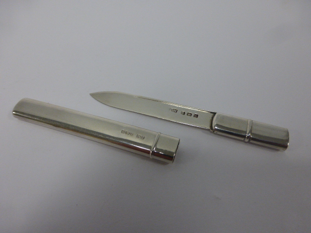 A silver desk letter opener with case, hallmarked Birmingham 1925, by makers Francis Webb Ltd., 8.