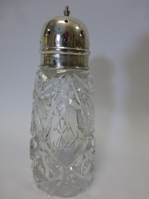 Silver mounted cut glass muffineer, hallmarked London 1927 by makers Wolfsky 7 Co., 17cms in height