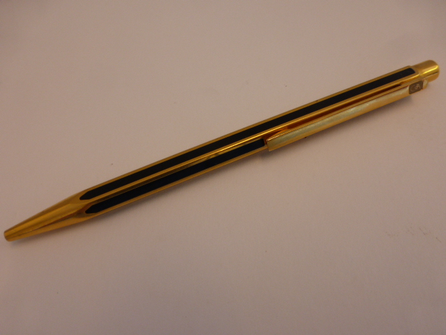 A Swiss Caran d`Ache Ecridor ballpoint pen of hexagonal form of black Chinese lacquer and gold