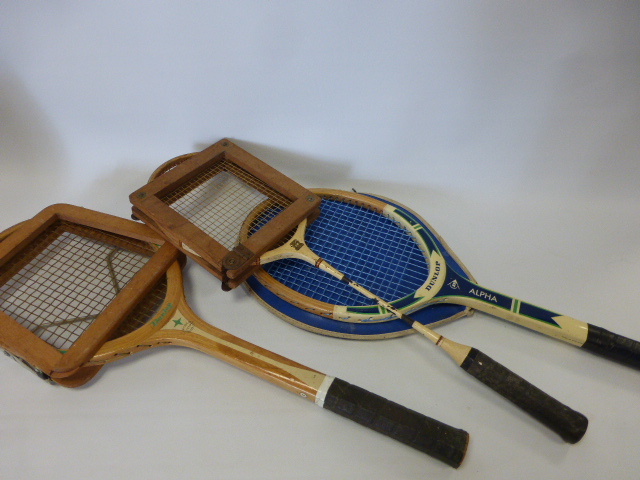 Two Dunlop Tennis rackets, one `Emerald Star` with wooden brace frame and with Hamleys of London