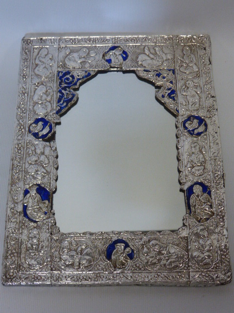 A Persian silver and blue enamel mirror, unmarked, of rectangular form, with overlay silver of