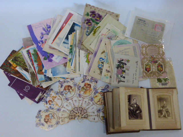 A collection of greeting cards, early 20th century onwards and Victorian photograph album and other