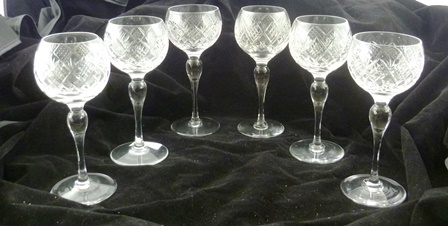 A SET OF SIX ENGLISH HOCK GLASSES with cut crucible bowls and bulb stems, 17cm high