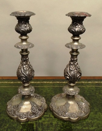 A PAIR OF LATE VICTORIAN/EDWARDIAN EPNS CANDLESTICKS each having detachable sconce, turned and