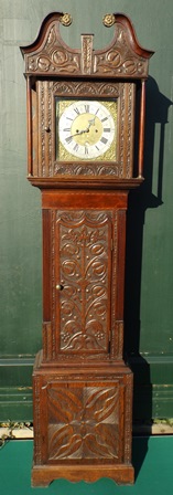 JAMES PEPPER, BIGGLESWADE A PART 18TH/19TH CENTURY OAK LONGCASE CLOCK, having heavily carved