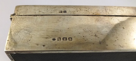 ** & CO AN OBLONG SILVER CIGARETTE BOX having engine turned domed hinged lid unengraved with timber - Image 4 of 4