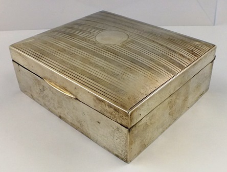 ** & CO AN OBLONG SILVER CIGARETTE BOX having engine turned domed hinged lid unengraved with timber - Image 2 of 4