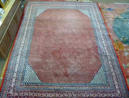 A HAMADAN PERSIAN CARPET, having madder and ivory centre with multiple desert flowers within a - Image 2 of 2