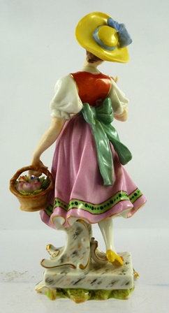 A MID/LATE 20TH CENTURY GERMAN PORCELAIN FIGURE of a girl in stylised 18th century dress, coloured - Image 2 of 3