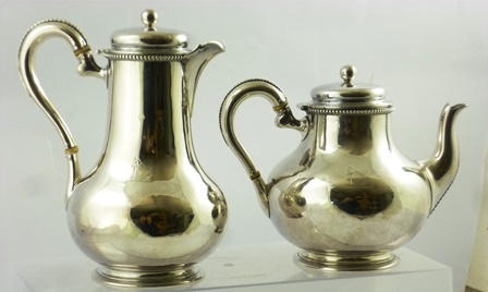 ARTHUR SIBLEY A VICTORIAN SILVER COFFEE POT AND MATCHING HOT WATER, each of plain baluster form