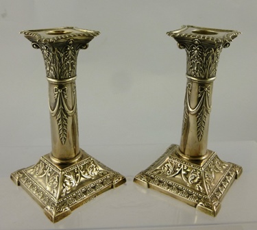 HENRY WILKINSON & CO A PAIR OF SILVER NEO CLASSICAL STYLE CANDLESTICKS each having detachable