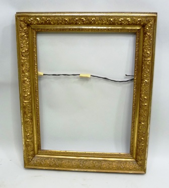 A 19TH CENTURY GILT FOLIATE DECORATED PICTURE FRAME 62cm x 47cm interior, 80cm x 62cm exterior