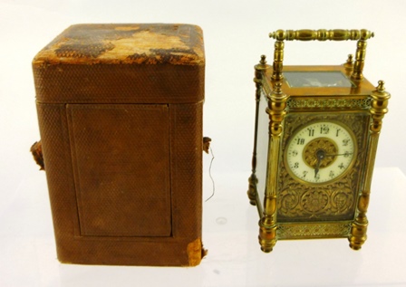 A LATE 19TH/EARLY 20TH CENTURY BRASS (previously gilded) CARRIAGE TIMEPIECE having ""turned"" and