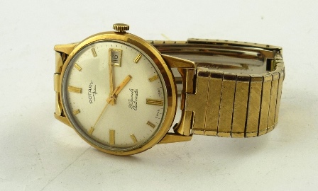 A 1960`s 9CT GOLD GENTLEMAN`S ROTARY MECHANICAL AUTOMATIC WRIST WATCH having silvered baton dial,