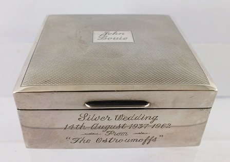 HARRISON BROS. A SQUARE SILVER CIGARETTE BOX, having engine turned top and polished surround with