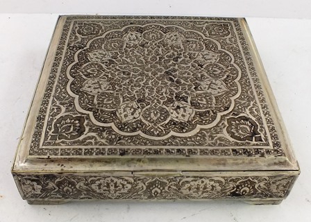 AN ASIAN SILVER COLOURED METAL SQUARE TACK BOX having all-over engraved tooled decoration, 2.5cm x