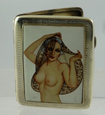 JOSEPH GLOSTER LTD AN OBLONG SILVER CIGARETTE CASE having a fitted enamel tablet of a naked lady