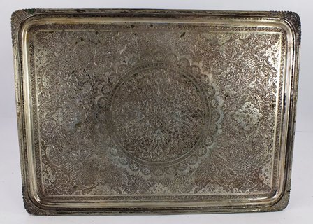 AN EARLY 20TH CENTURY ASIAN SILVER COLOURED METAL VANITY TRAY having tooled corners and engraved