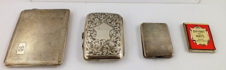 TWO SILVER CIGARETTE CASES, one engine turned front and back, the other rectangular cushion with