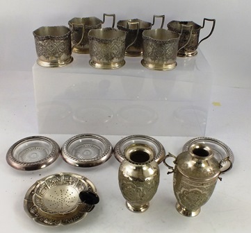 AN ASSORTMENT OF ASIAN SILVER COLOURED METAL ITEMS comprising; six tea holders, strainer and dish,
